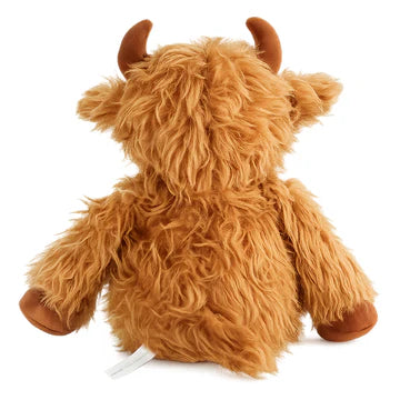 Plush toy Highland cow on a white background