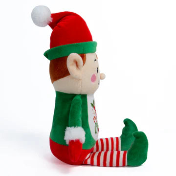 Christmas elf plush toy with red hat and green pants on a white background