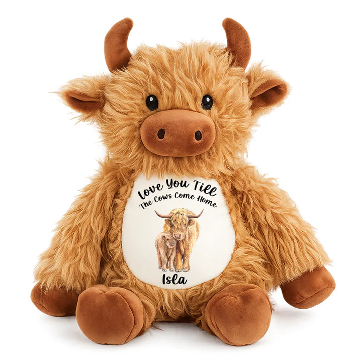 Plush toy cow with a message on a white background