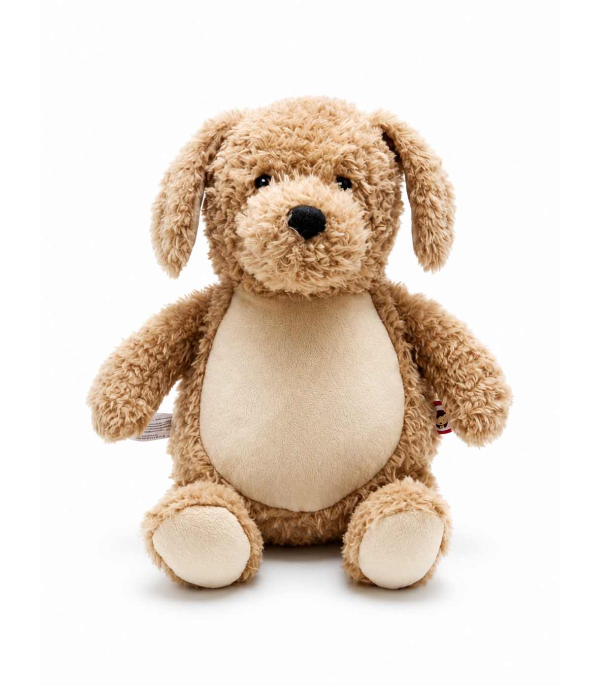 A plush dog toy in light brown and cream, photographed against a seamless white background.