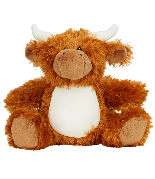 Plush toy Highland cow on a white background