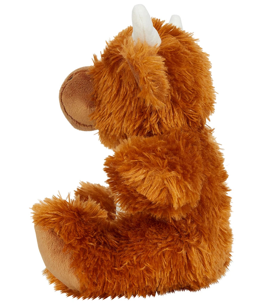 Plush toy cow a brown color scheme on a white background