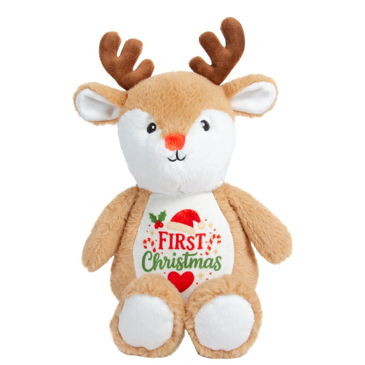 A plush toy reindeer with brown antlers and a white belly patch that reads 'FIRST Christmas' with red and green holiday graphics, shown on a plain white background.