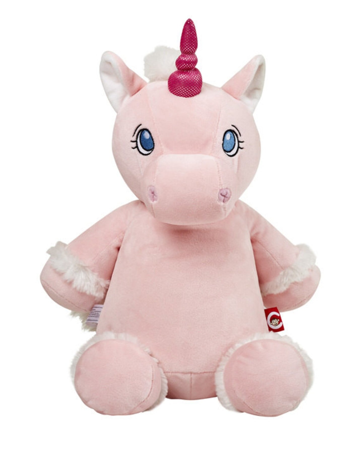 Pink unicorn plush toy with a white mane and blue eyes on a white background