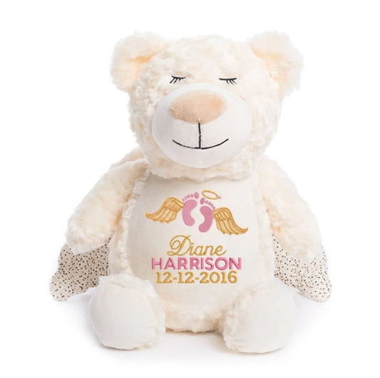 White teddy bear with personalized details on a white background