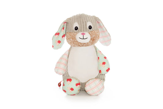 Plush toy rabbit with floral pattern on a white background
