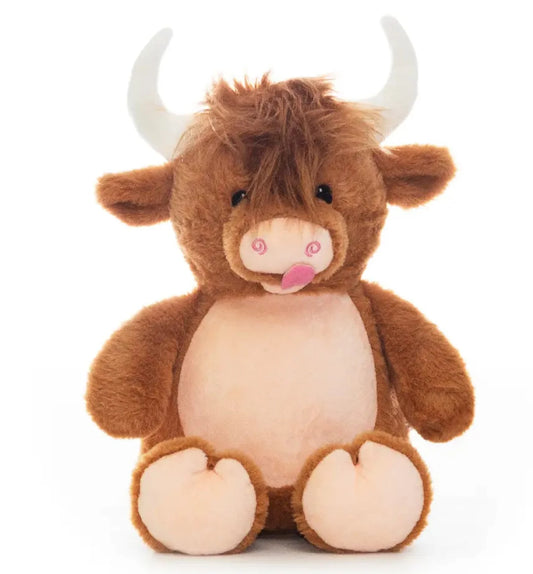 Plush toy highland cow on a white background