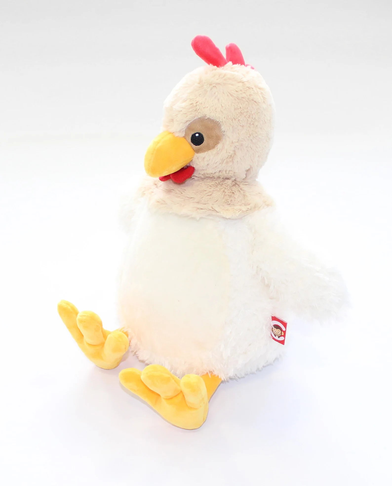 Plush chicken toy with a red comb on a white background