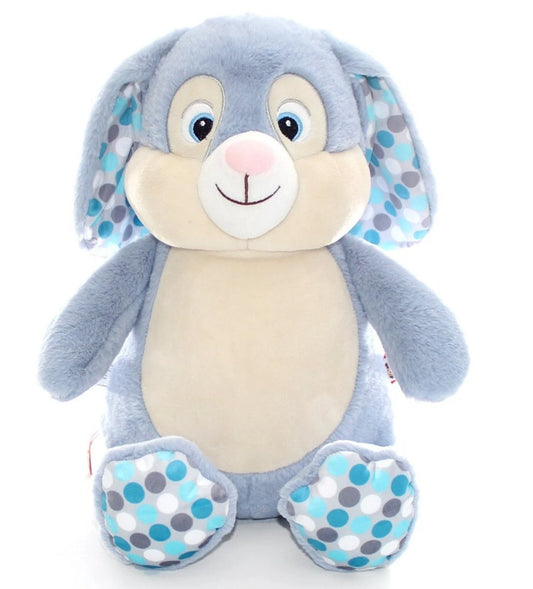 Plush toy rabbit with blue and gray polka dot pattern on a white background