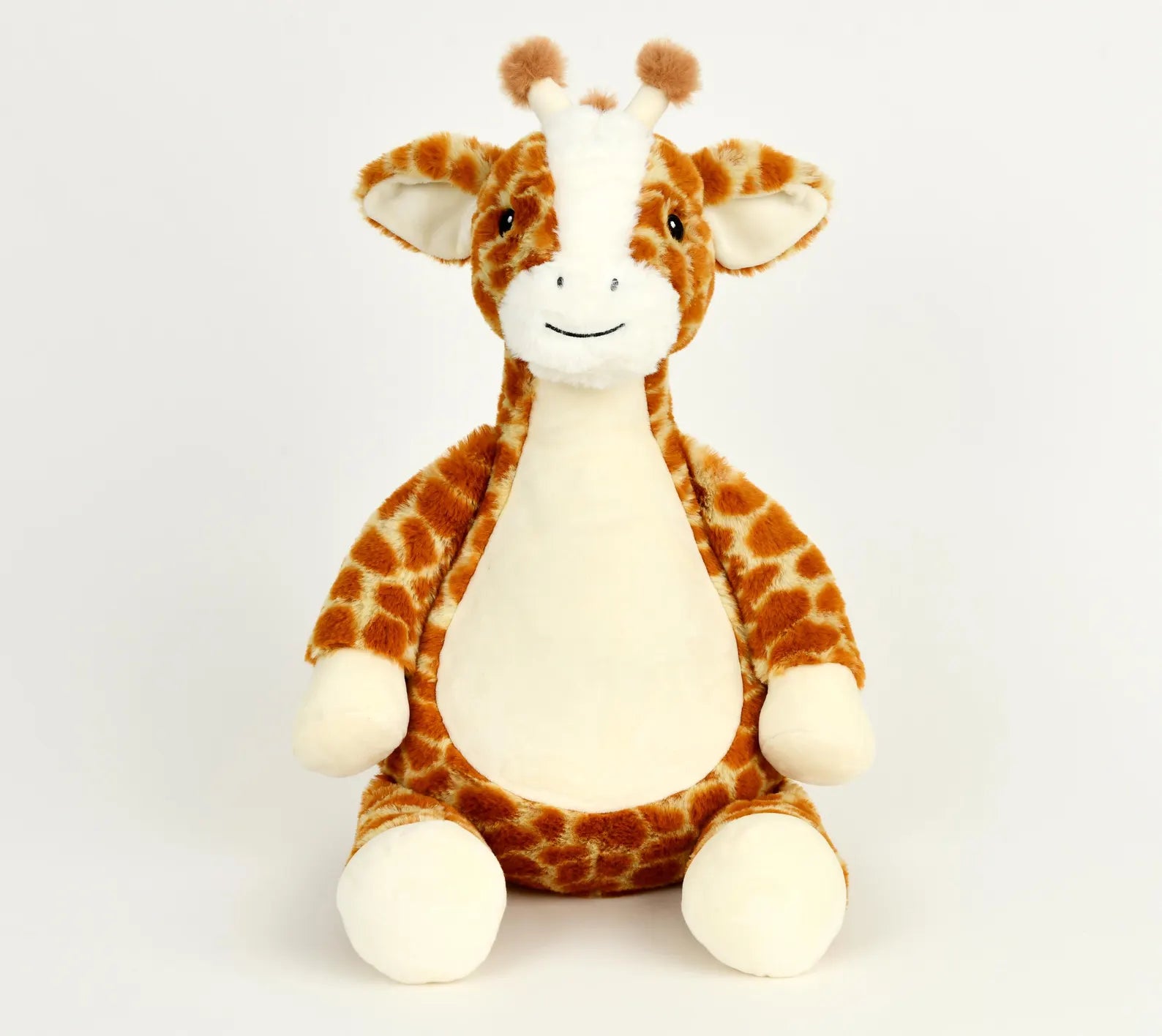 Plush giraffe toy on a white background