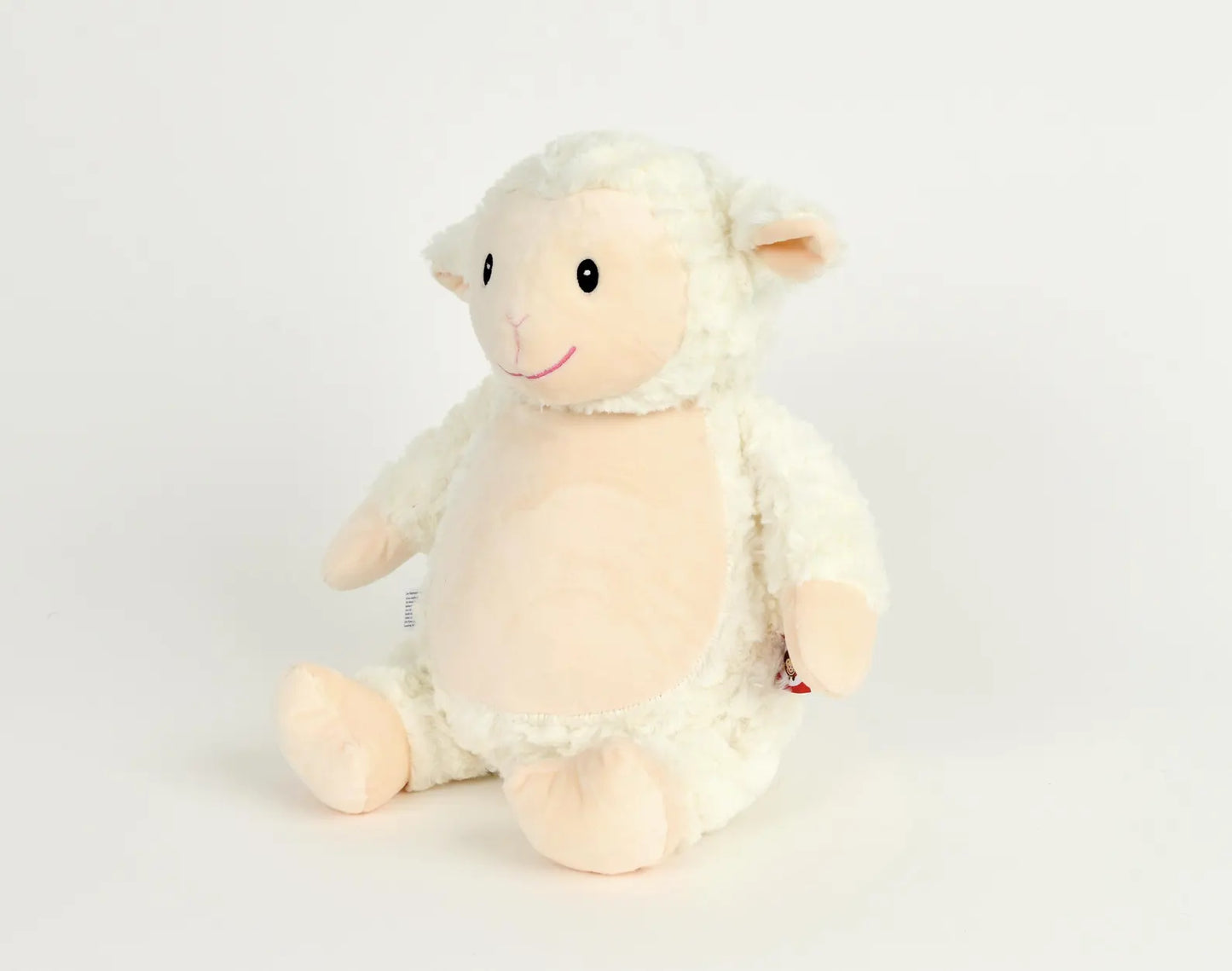 Plush toy sheep on a white background