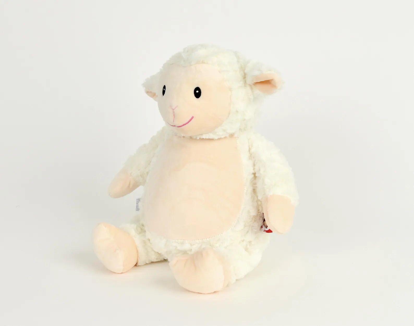 Plush toy sheep on a white background
