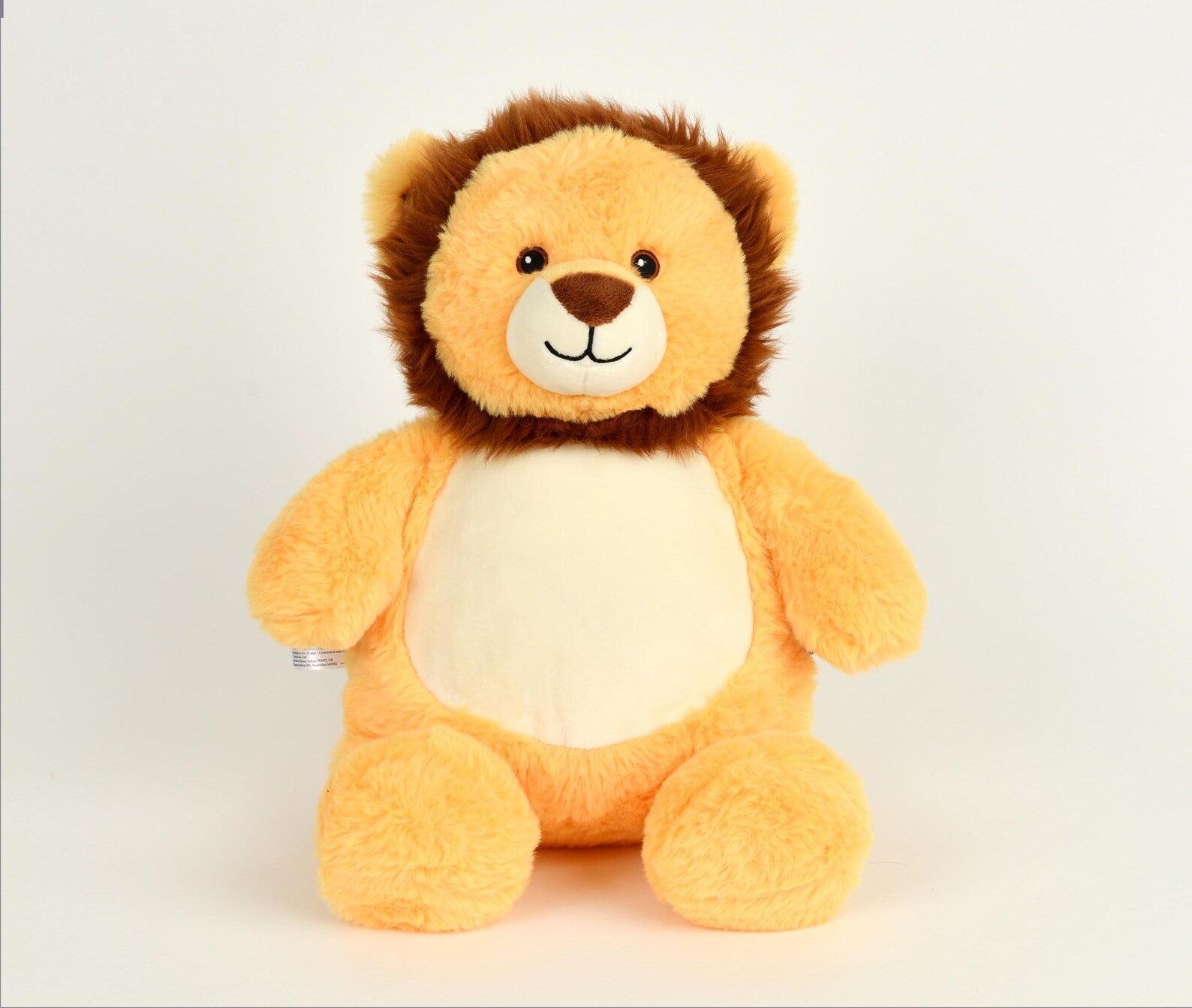 Plush lion toy on a light gray background