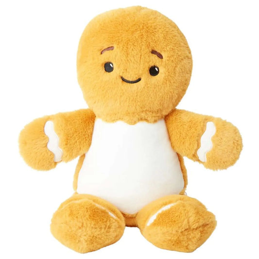 Plush gingerbread man toy with a round body, white belly, and yellow arms and legs on a white background