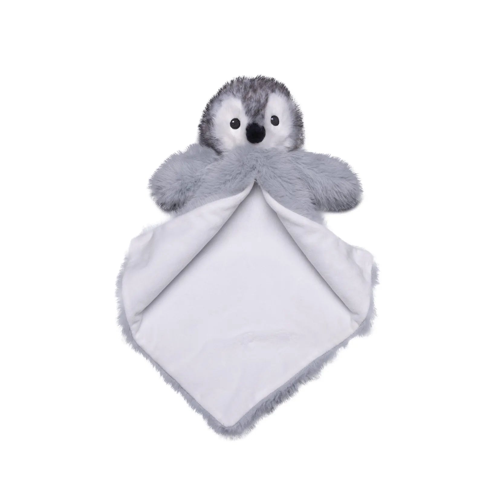 Plush penguin toy with a white blanket on a white background