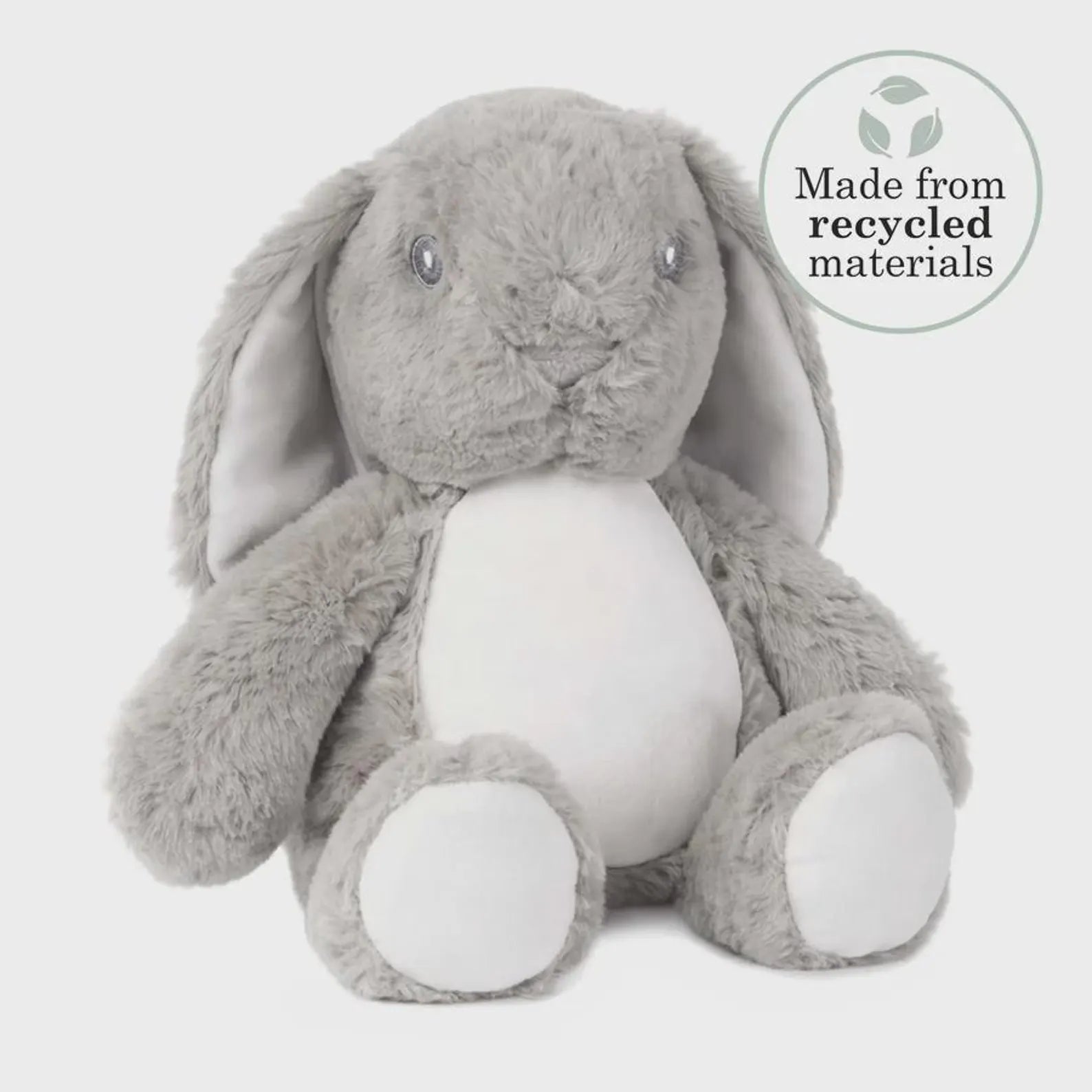Gray plush bunny toy with a white belly on a white background, featuring a 'Made from recycled materials' label.