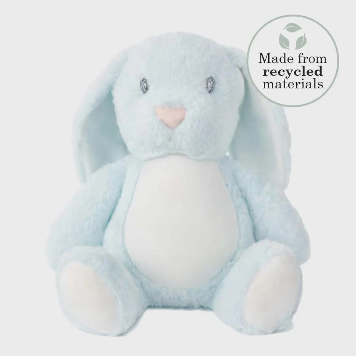 Blue plush bunny toy with a heart nose on a light gray background, featuring a 'Made from recycled materials' label.