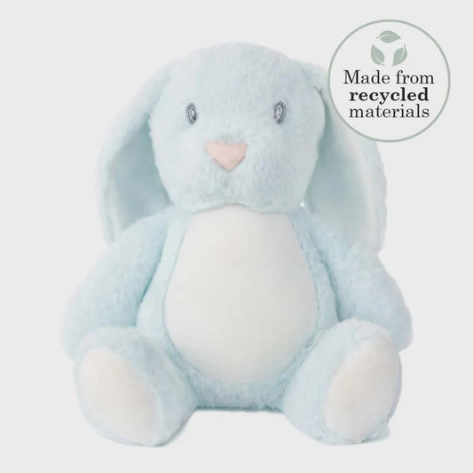 Blue plush bunny toy with a heart nose on a light gray background, featuring a 'Made from recycled materials' label.