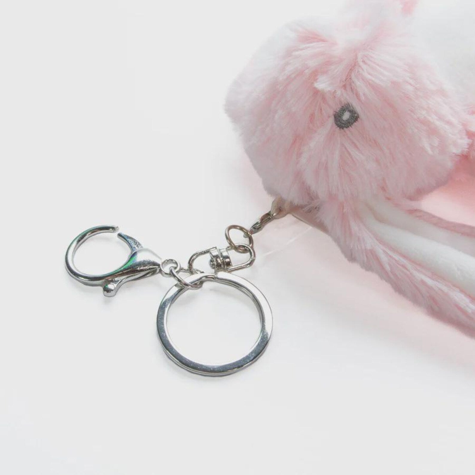 Silver keychain with a plush bunny rabbit 