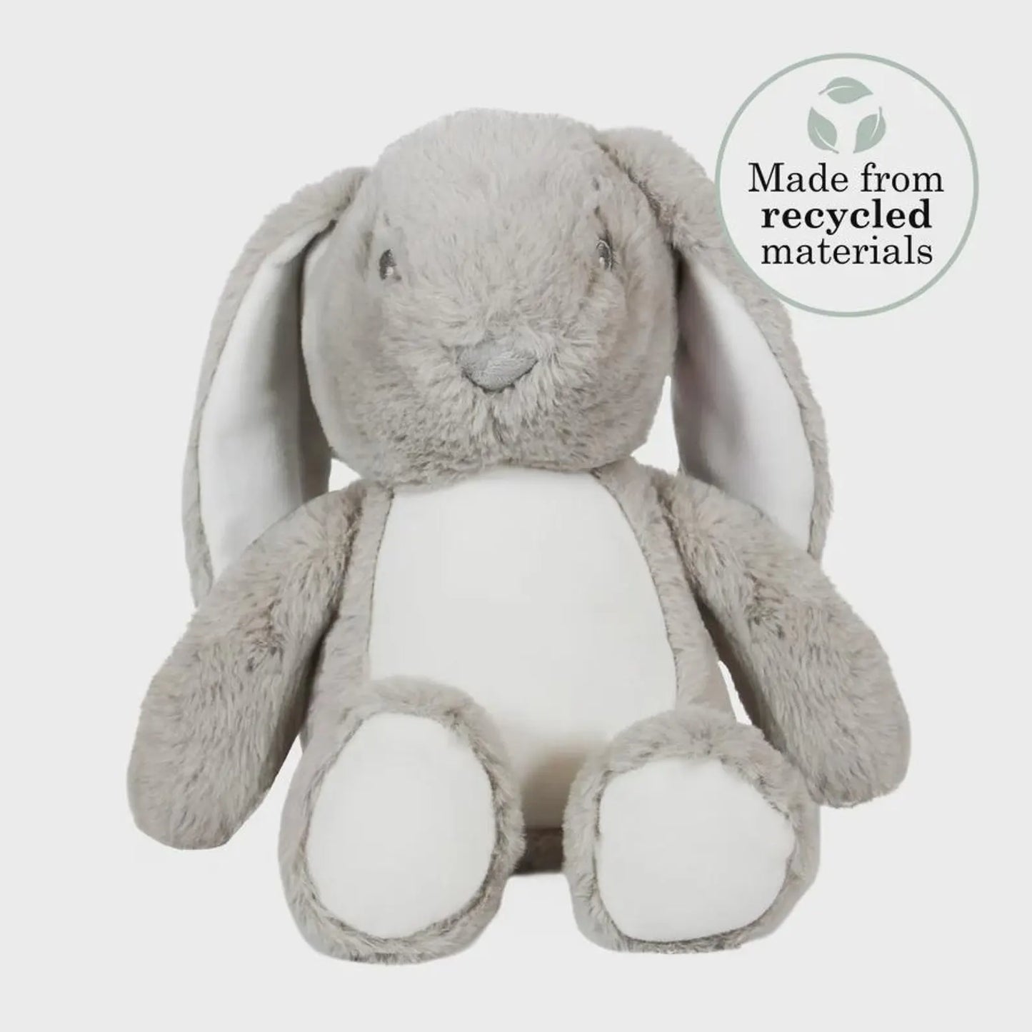 Gray plush bunny toy with a label indicating recycled materials on a white background