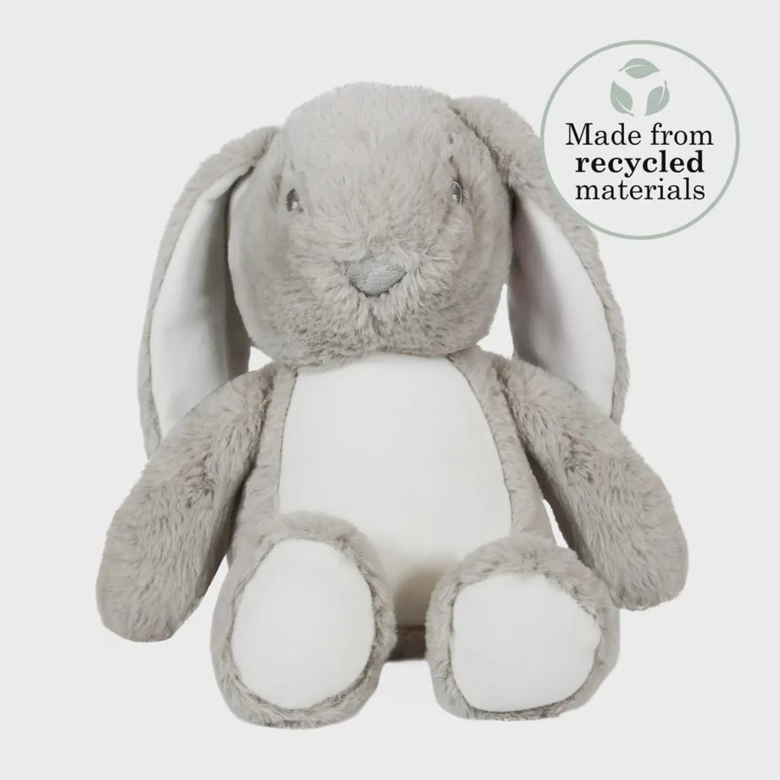 Gray plush bunny toy with a label indicating recycled materials on a white background