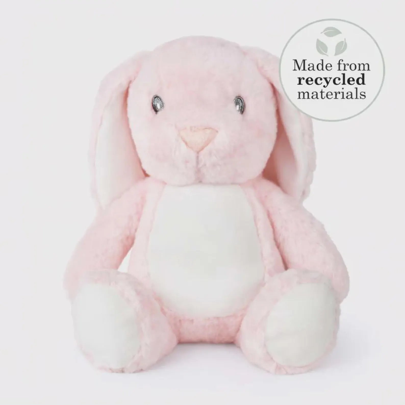 Pink plush bunny toy with 'Made from recycled materials' label on a white background