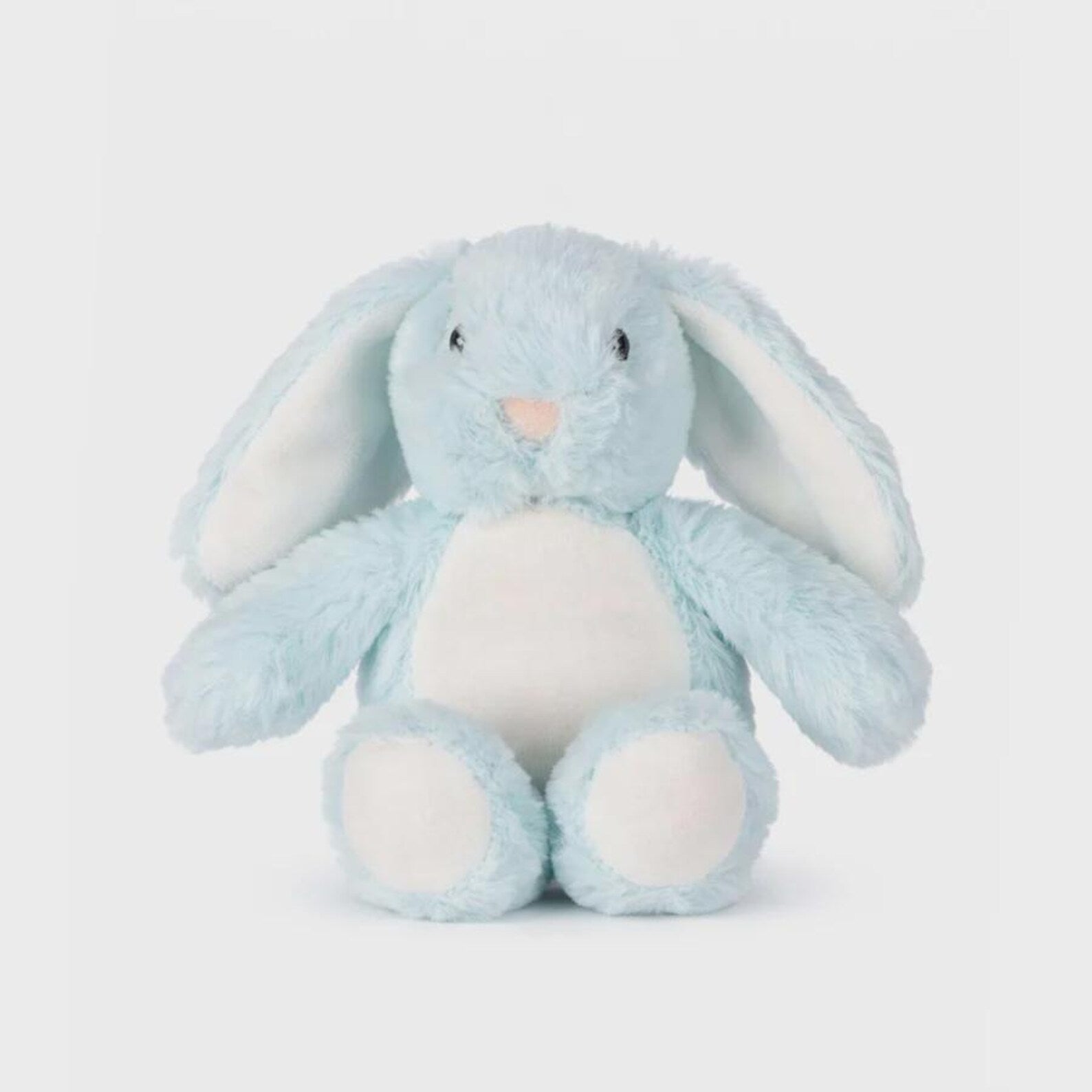 Blue plush bunny toy on a light gray background