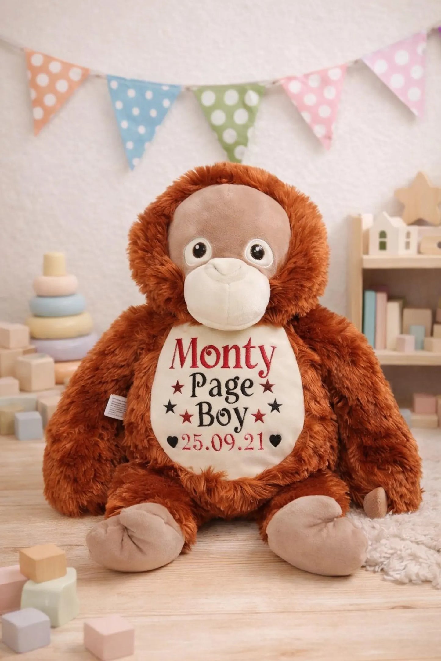 Stuffed monkey toy with personalized text in a child's room