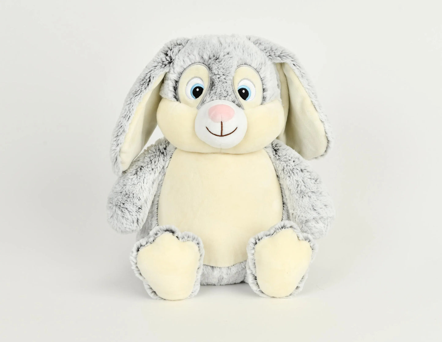 Plush toy rabbit with gray fur on a light gray background