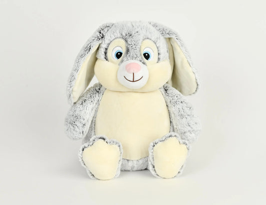 Plush toy rabbit with gray fur on a light gray background