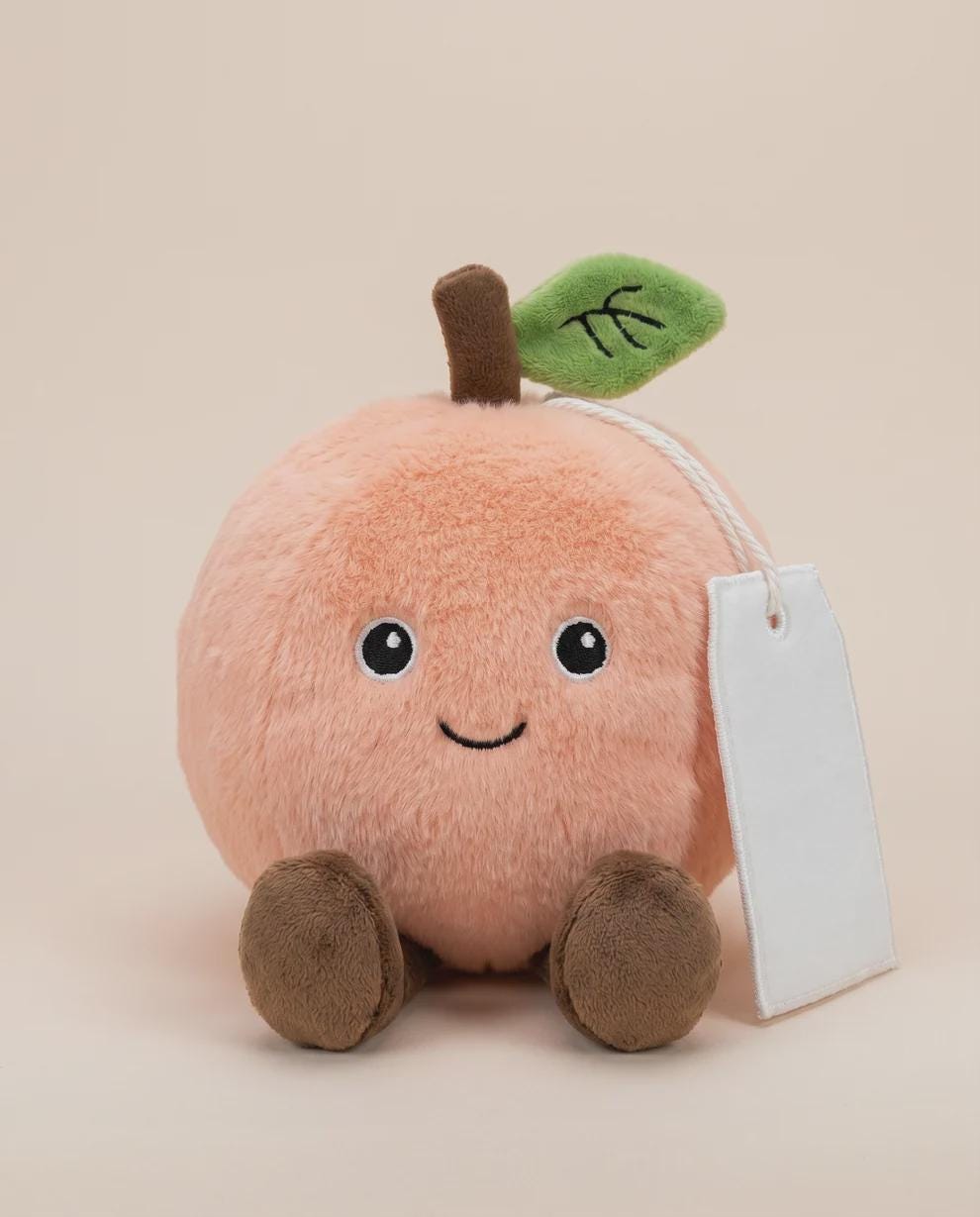 Poppy the Peach plush with personalised printed tag